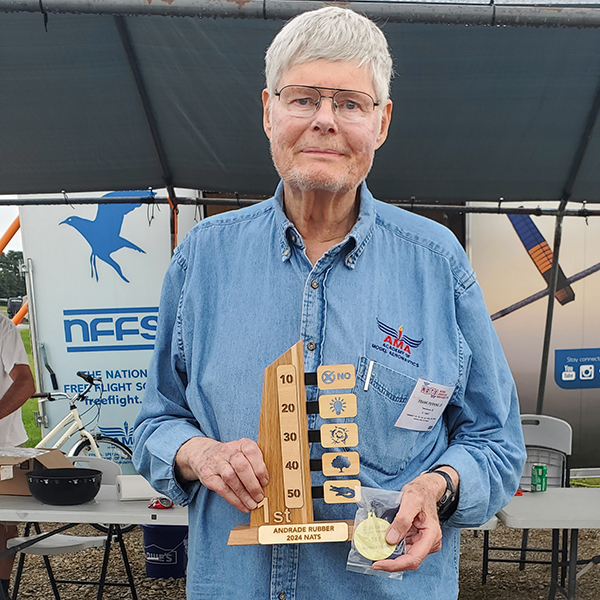 Frank Perkins holding his Andrade Trophy after winning the event.