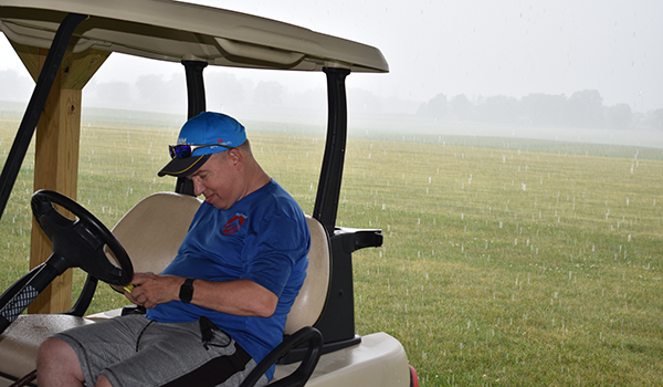 Contest Director John Boyko pondering his options as heavy rain continues.