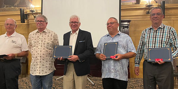 The 2024 FF Hall of Fame class was inducted at the NFFS annual banquet on Wednesday. Pictured are (L-R) Glenn Schneider, two son