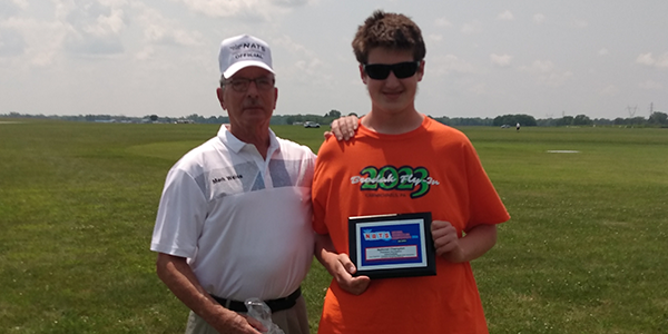 :] Angstrom Eberenz receives his National Champion award from Mark Weiss.