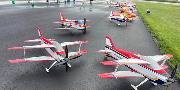 The FAI pilots’ airplanes lined up during the Unknown rounds on Friday just after the rain passed over. Photo by Rusty Dose.