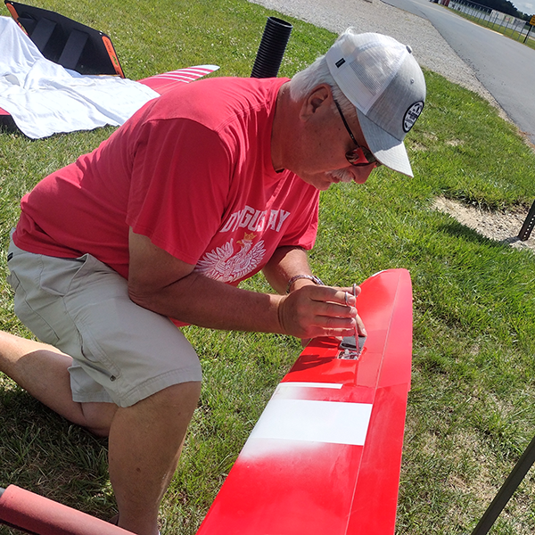 Wally Adasczik works on his Supra.