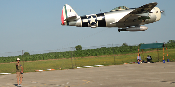 Lynn Boss flying his .90-powered four stroke P-47D that featured throttle, flaps, a bomb drop, and retractable landing gear.