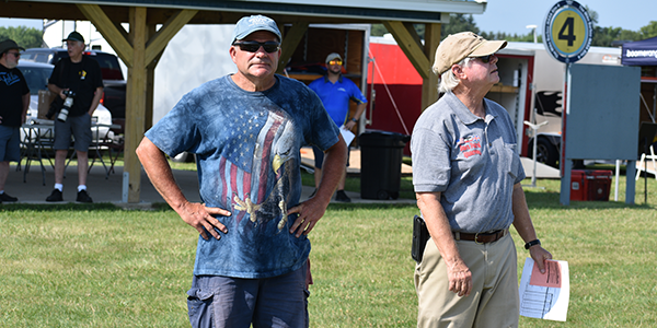 District III Vice President Randy Adams (L) and his caller, Ron Mienheartt (R), discuss strategy for Round 1.