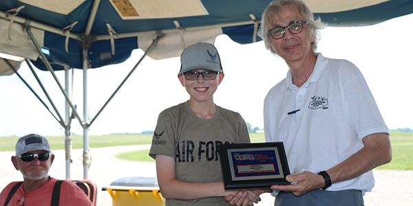 Christopher DeGroff receiving his second-place 1/2a Scale award.