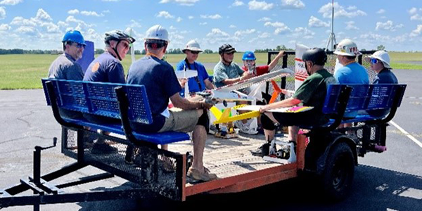 The cart is loaded up to move racers to and from the starting line!