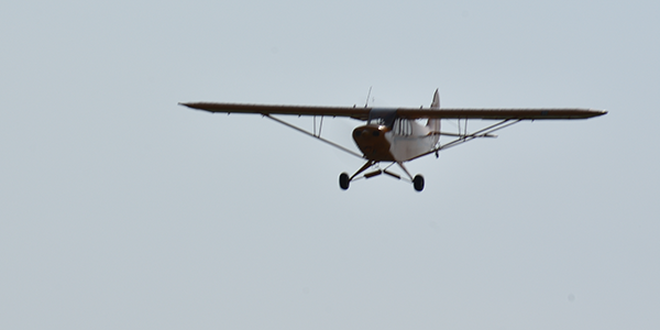 Larry Folk’s 1/3-scale Cub lined up on its final approach.