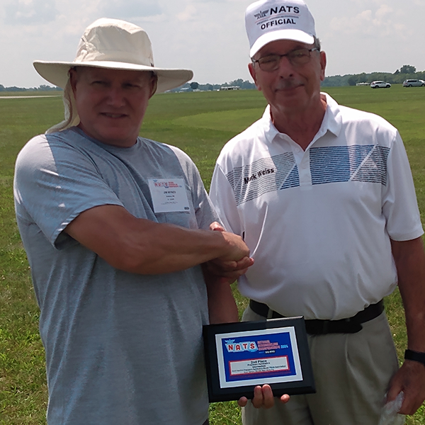 Jim Mynes receives his plaque for second place from Mark Weiss.