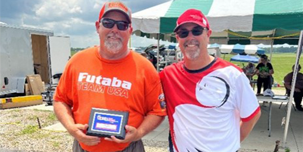 Dean (L) being presented with his fourth-place award by Doug (R). 