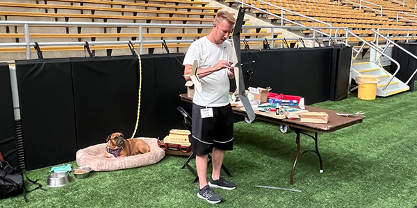 Sean McEntee and Bella working his Hand-Launched Glider aircraft.