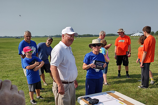 Naomi Macklem receives her trophy.