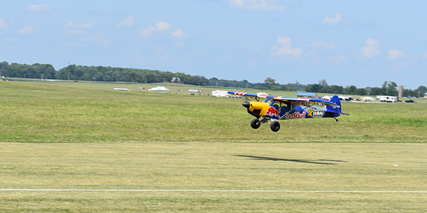 A large airplane, The Hangar 9 FX-3 Carbon Cub, is powered by a DLE-170 engine.