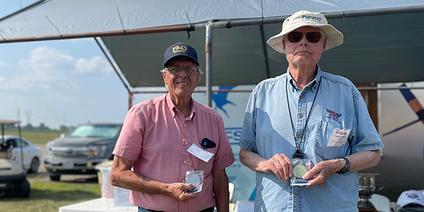 The E-20 champion, Frank Perkins, with runner-up Paul Bradley.