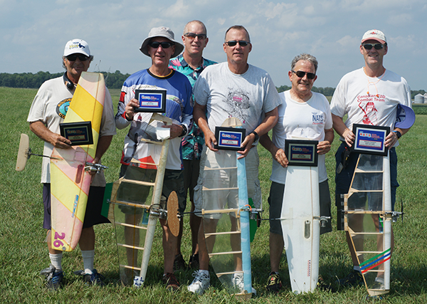 The 2024 Speed Limit winners (L-R): Pete Athans, fifth; Leonardo Silva, fourth; Event Director Dave Edwards (behind); Brian Stas