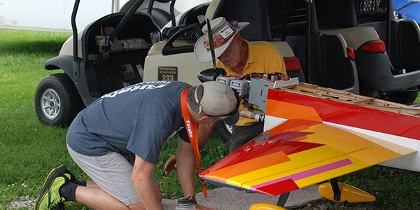 Bill Daniels and Ty Lyman working on Bill’s airplane at the end of the day.