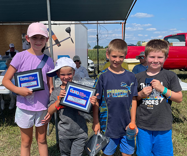 The Junior P-30 podium: Paul Finn, first; Caleb, second; and Sadie Menanno, third.