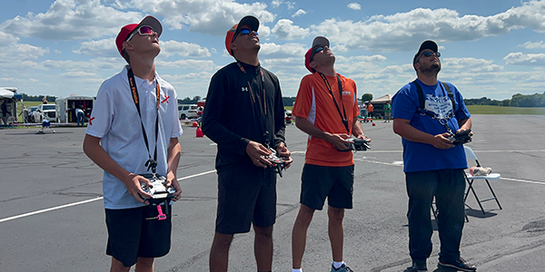  Look up to the skies and see … a four-pilot tandem flight! Pictured are (L-R) Kody, Misael Lopez, Kevin, and Johnny Gago.