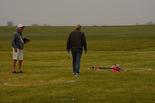 Gordie Meade with Mike Goza, who is judging a landing. Notice the winter clothing