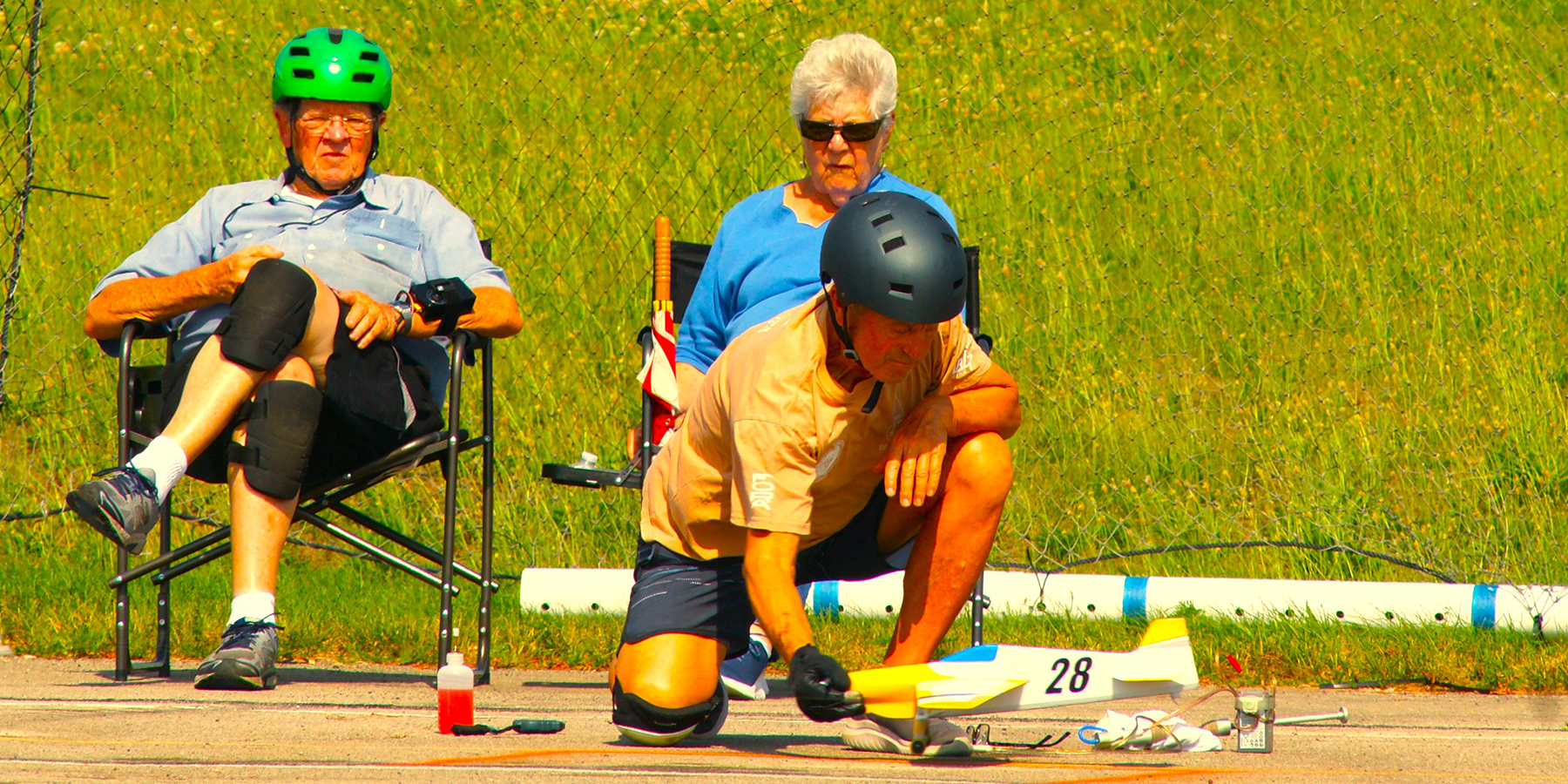 Bill Lee takes a break from pitting duties and times a race with his wife, Sandra. F2C team member Alexander Elbert nose-catches