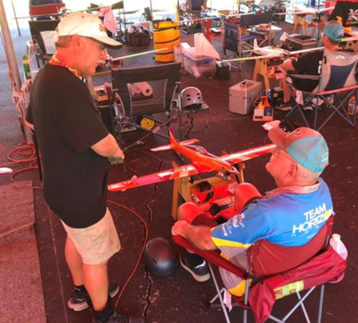 Two racing legends talking shop. Brian Richmond (left) and Kent Nogy (seated). Kent is flying his K&amp;B color inspired MFL, while 