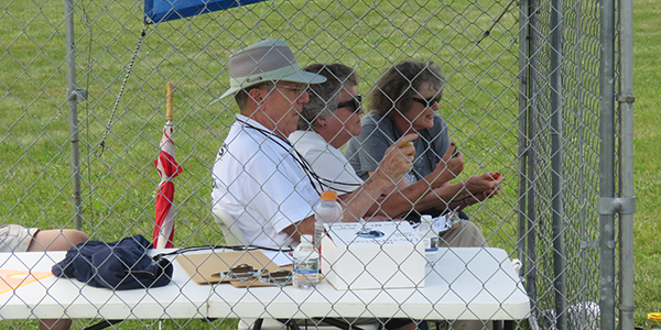 Timers Dick, Susan Perry, and Mrs. Hawk timing a flight.