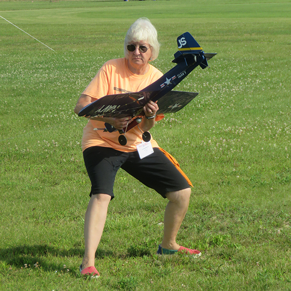 Jo Shoemaker giving her model a pull test prior to its flight.