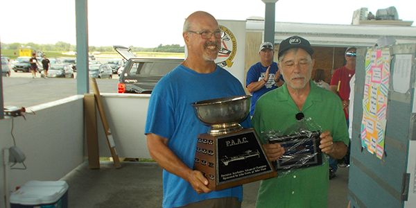 Rick Campbell receiving his National Advanced Class Champion Award from John Paris.