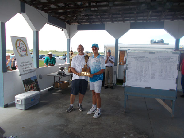 Gabriel accepting the Senior Perpetual Trophy. 