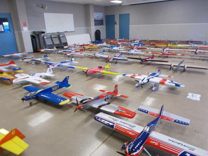 66 airplanes in a small room makes for a very crowded room