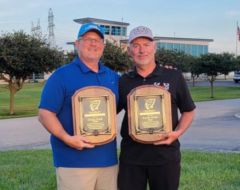 Dan Kane (left) with Randy Rich holding plaques to commemorate the induction of Randy’s late father “Dickie” and Randy into the NMPRA Hall-of-Fame.