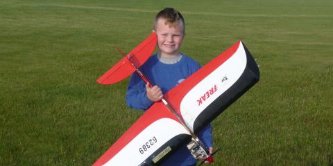 Tyler Skukalek with his airplane.