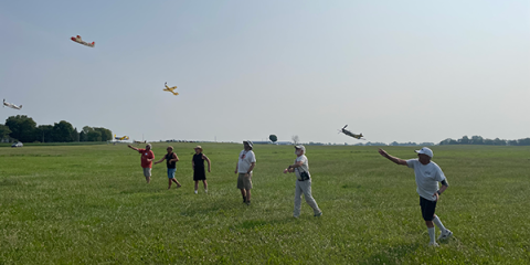 A mass launch during the first round of FAC Low Wing Military Trainer. Wally Farrell notches the win after three flight heats.