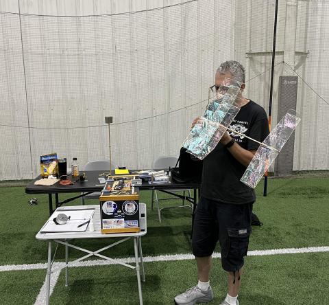 John Kagan with his Pennyplane. John Kagan with his Pennyplane.