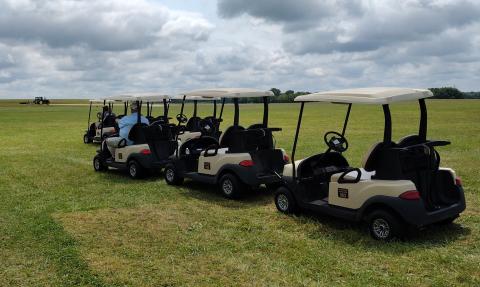 Returning the golf carts to the farm house.