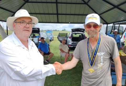 Ed Dumas receives gold in NOS.