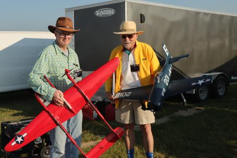 – Ron Duly with his YIPPEE P-38 and Pete Mazur with his Bearcat. Both models were flown in Fun Scale.