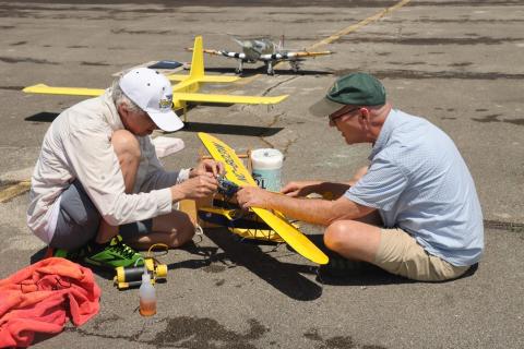 – Peter Bauer and Matthew Bauer working on Matthew’s Profile Scale Sikorsky flying boat.