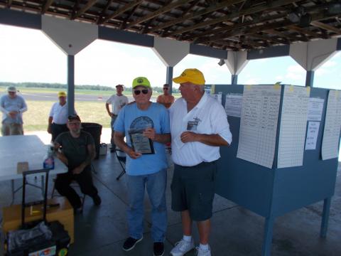 John Simpson receives his trophy for first place in Classic.