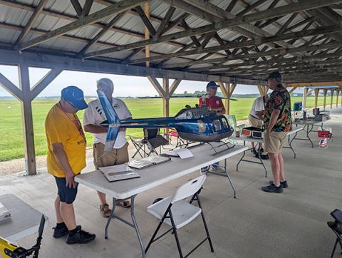 Judges Tom Dooley, Nob Muraki and Gordie Meade going over the critical details of the Bell 206 model.