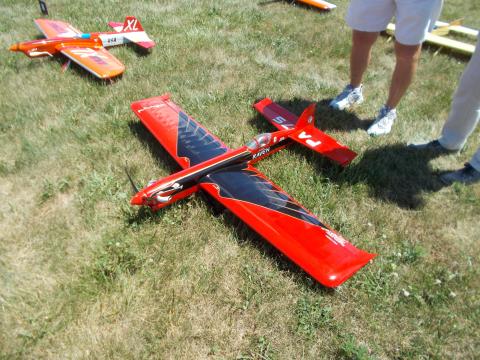 red and block model airplane