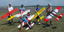 The top five pilots from 2022 (L-R): Paul Walker, Derek Barry, Kenny Stevens, and Todd Lee. Kneeling is Champion Orestes Hernandez.