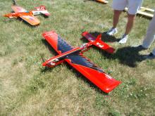red and block model airplane